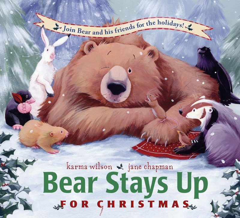 Book cover for Bear Stays Up for Christmas Written by Karma Wilson (Author) Picture of a sleeping bear with animals around a rabbit, a mouse, and other friendly animals around him.